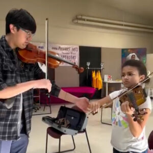 Rafael Vazquez with young student one to one